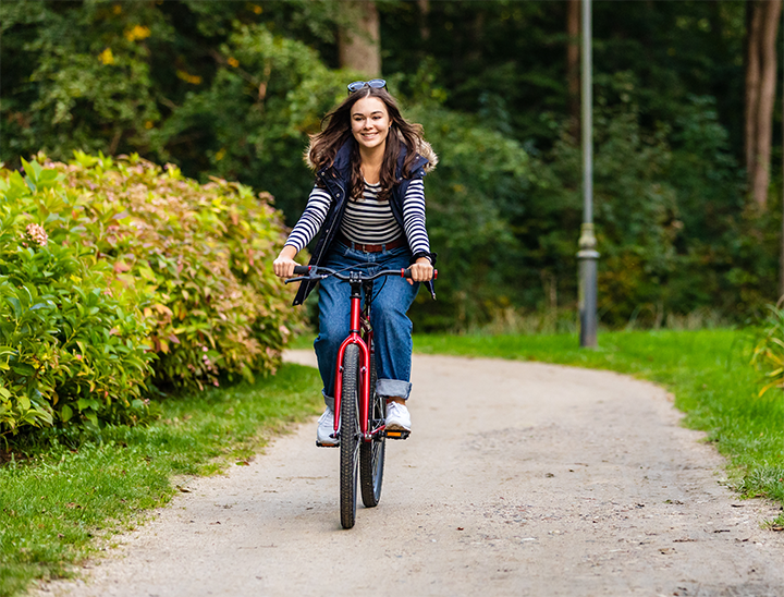 Person cycling along a public cycle path